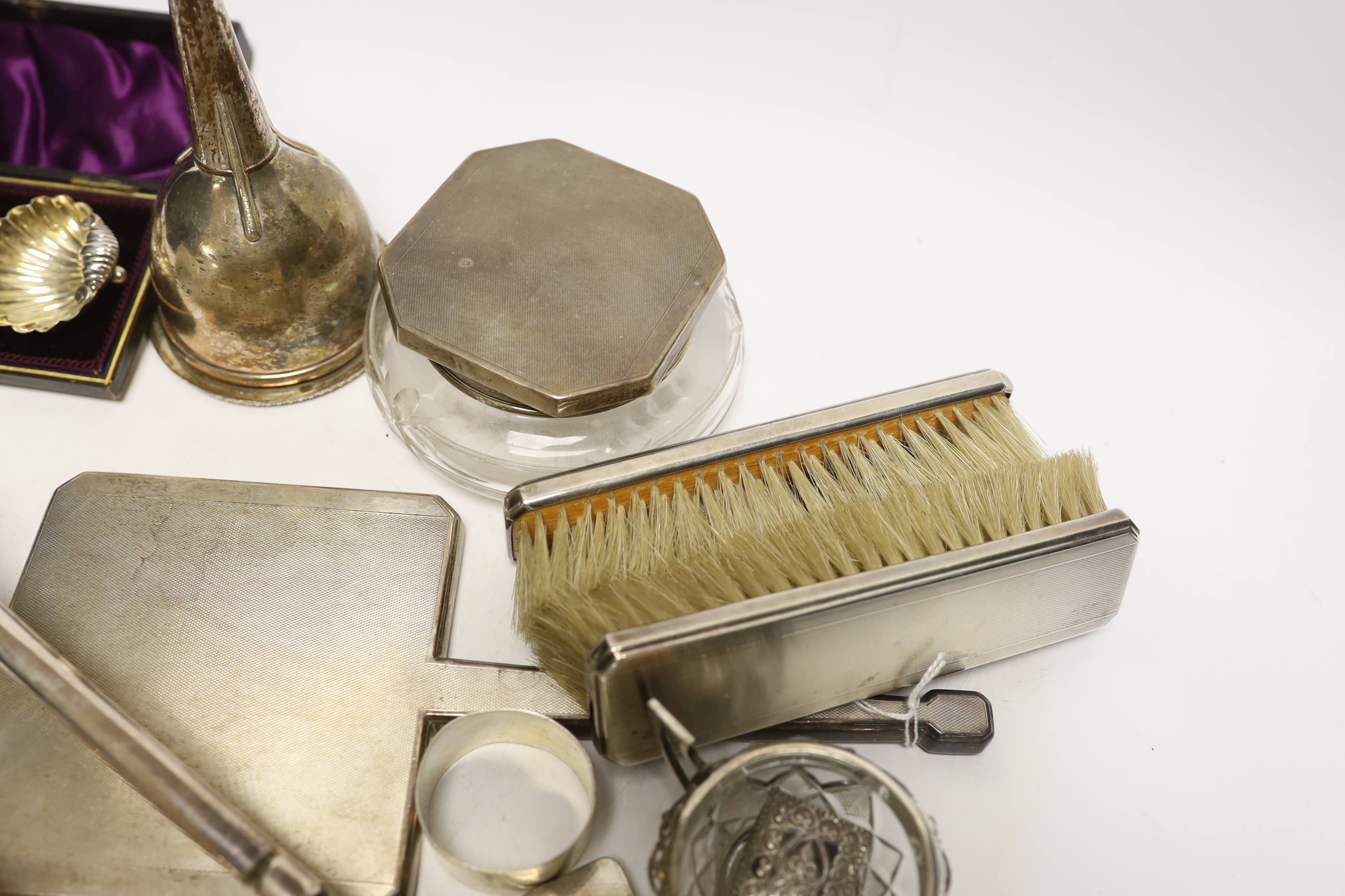 A group of assorted small silver, including a powder jar, trinket box, cigarette case, mirror and brush set etc. and a plated wine funnel.